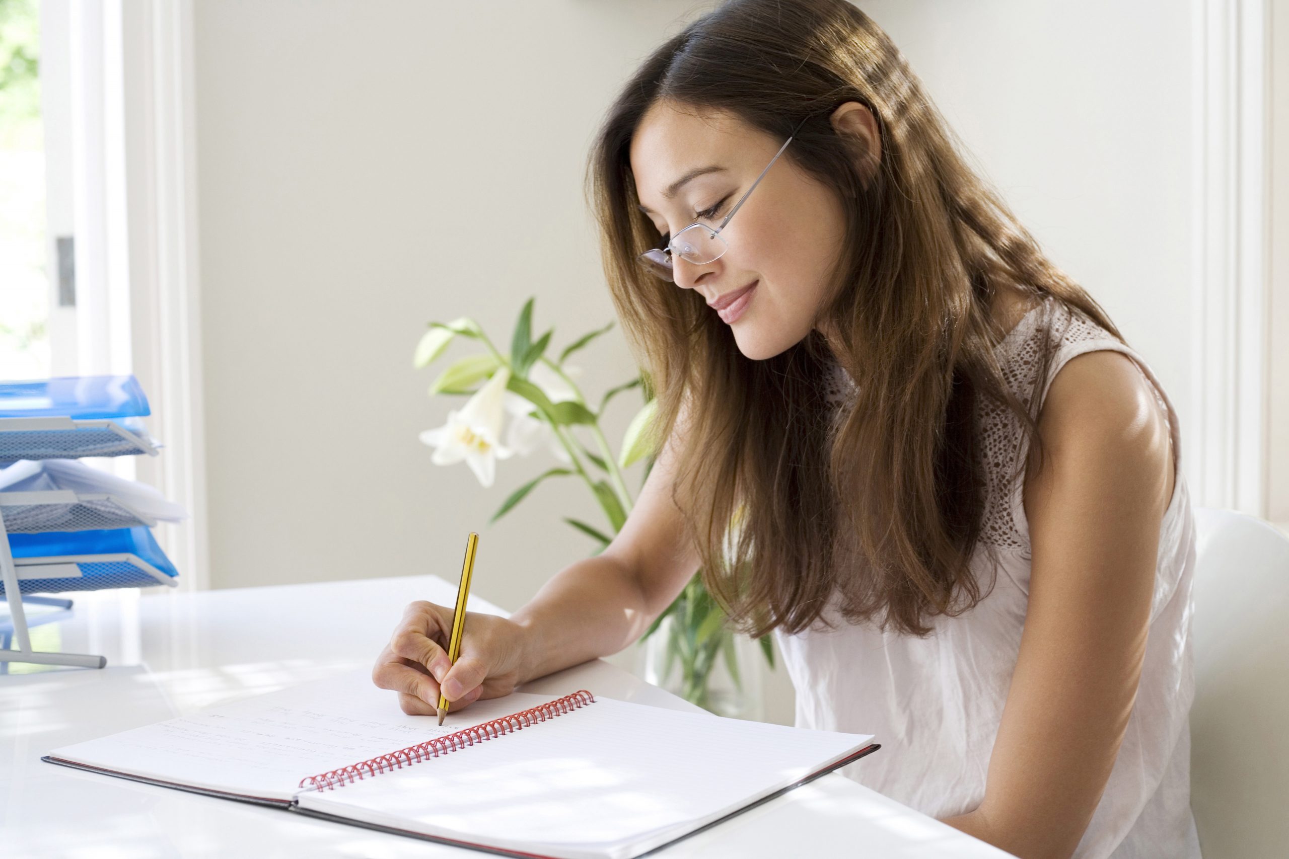 A woman sat at her desk in the Comfort Of Working From Home