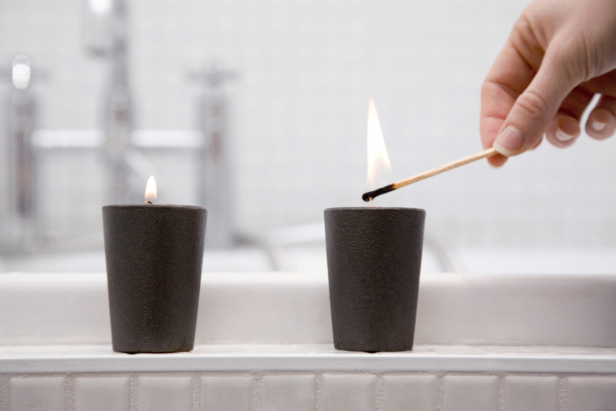 Lighting 2 small black candles