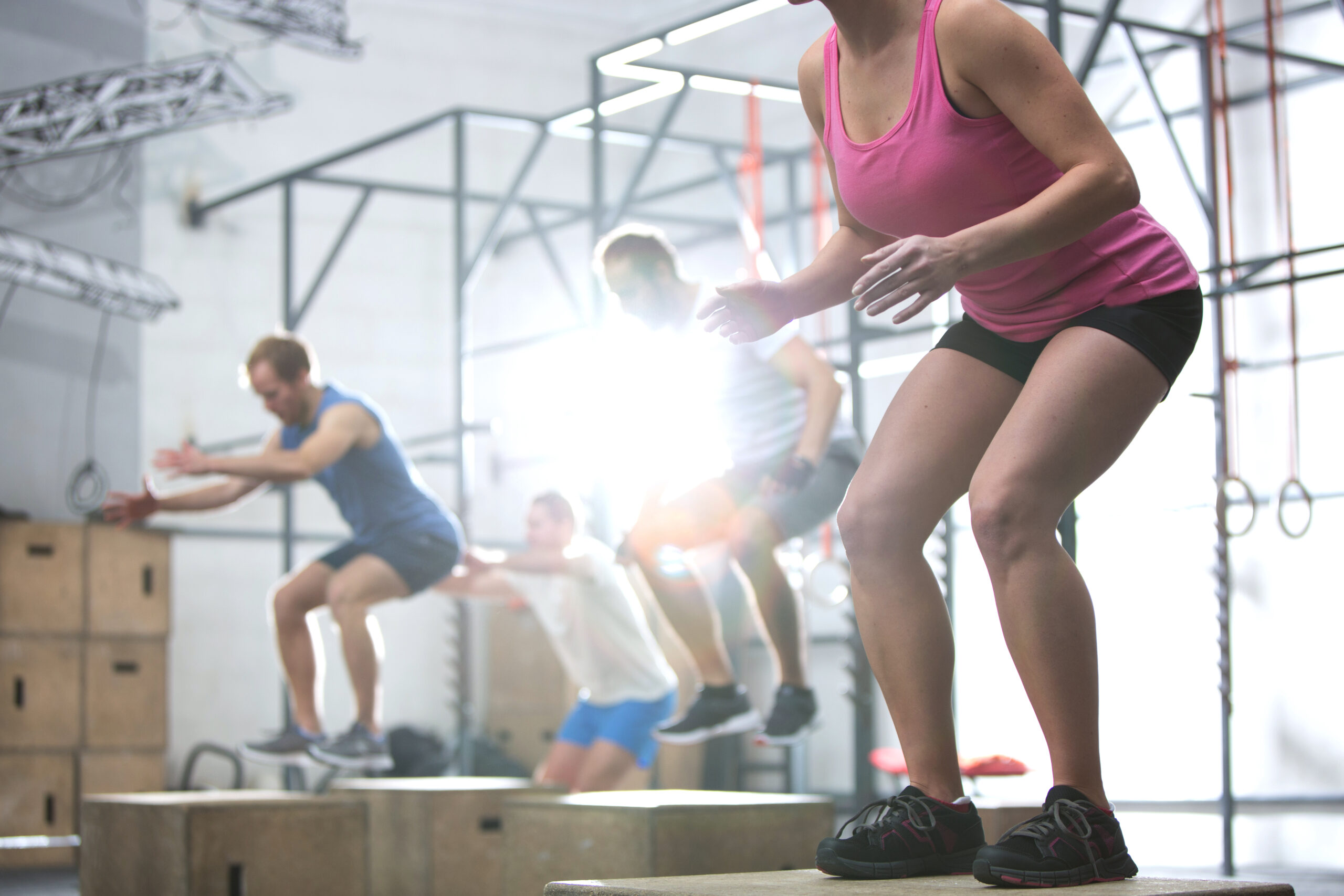 People doing box jump exercise in crossfit gym and How to Take Care of Your Body & Health When You Just Don’t Have Time