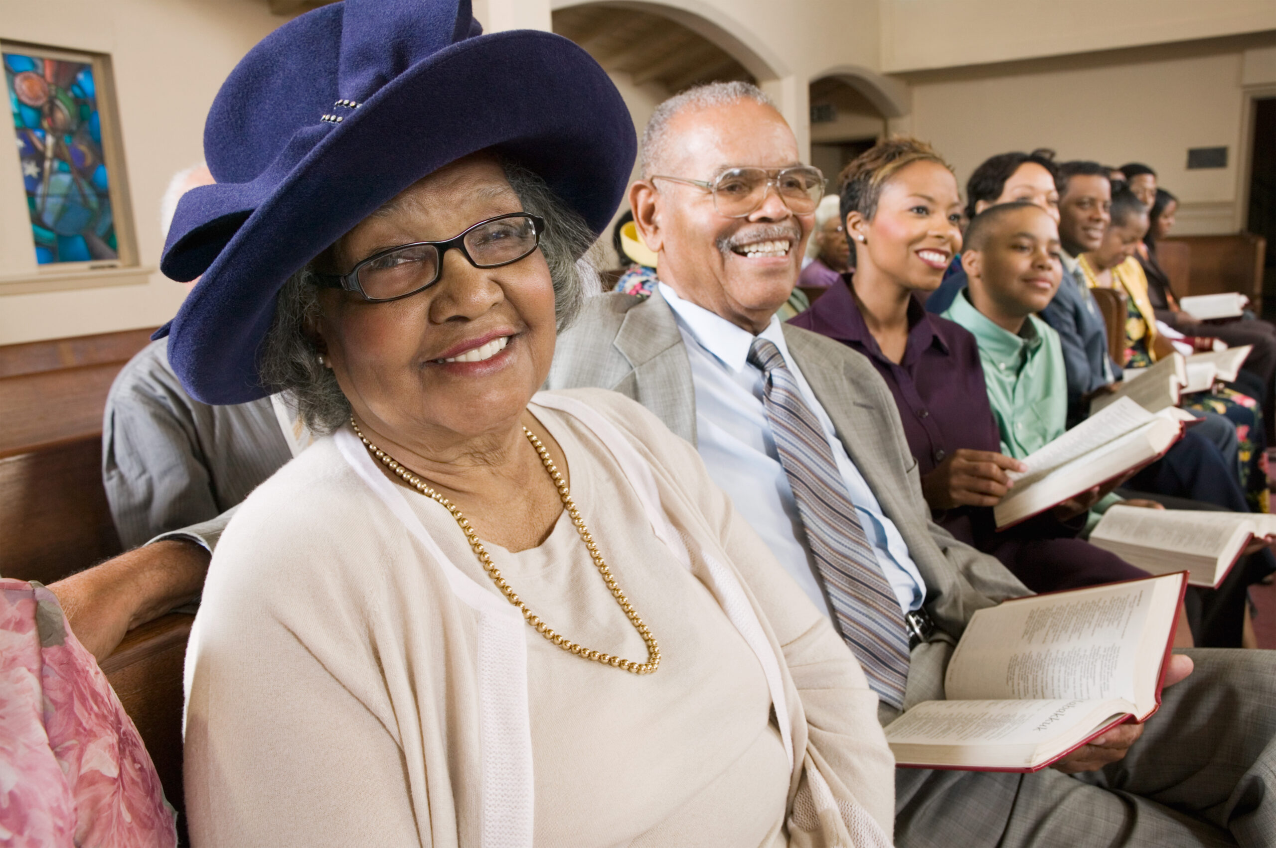 People sat on a church pew for Ultimate Guide To Planning Your Outfits For Church