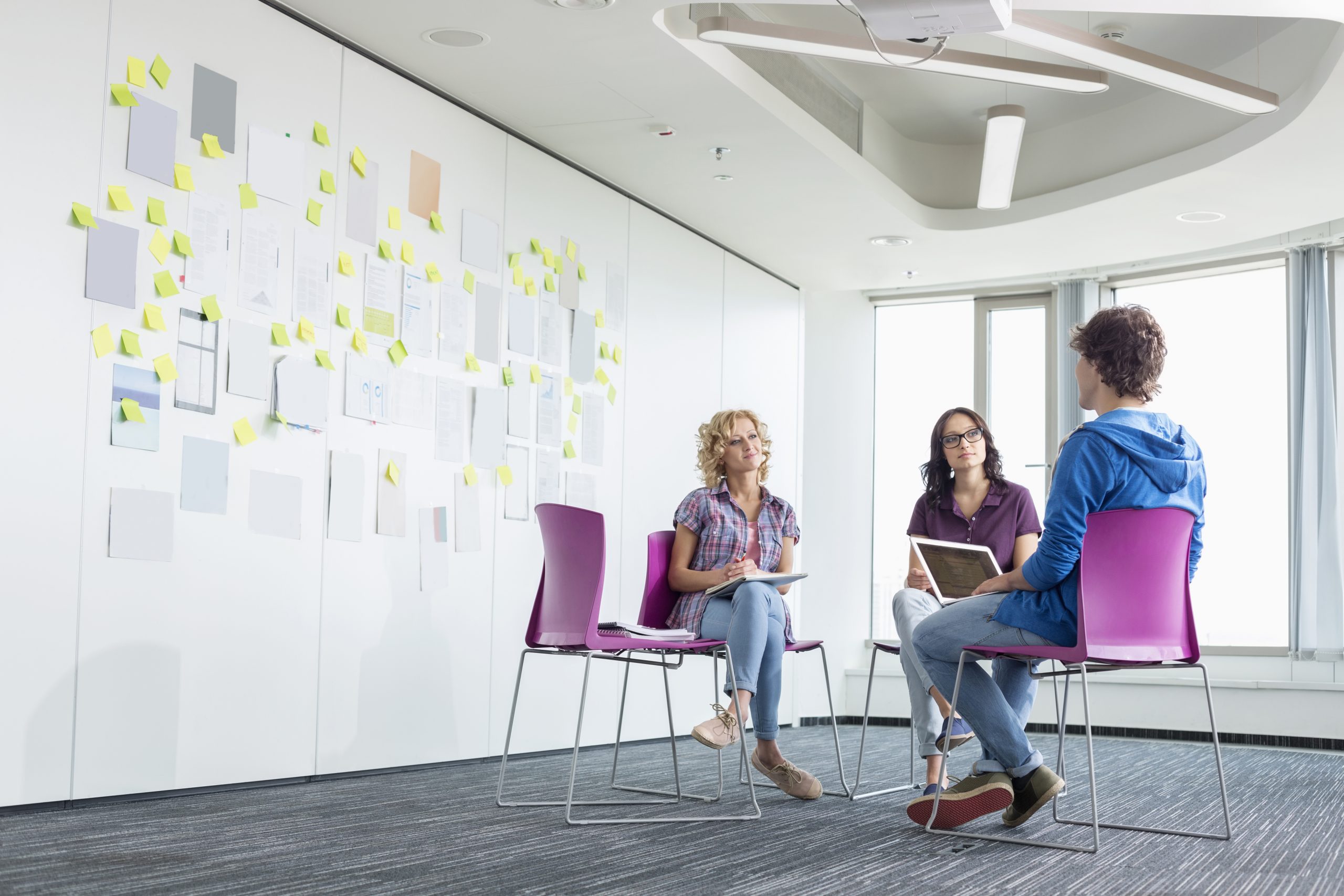Business people discussing in creative office space