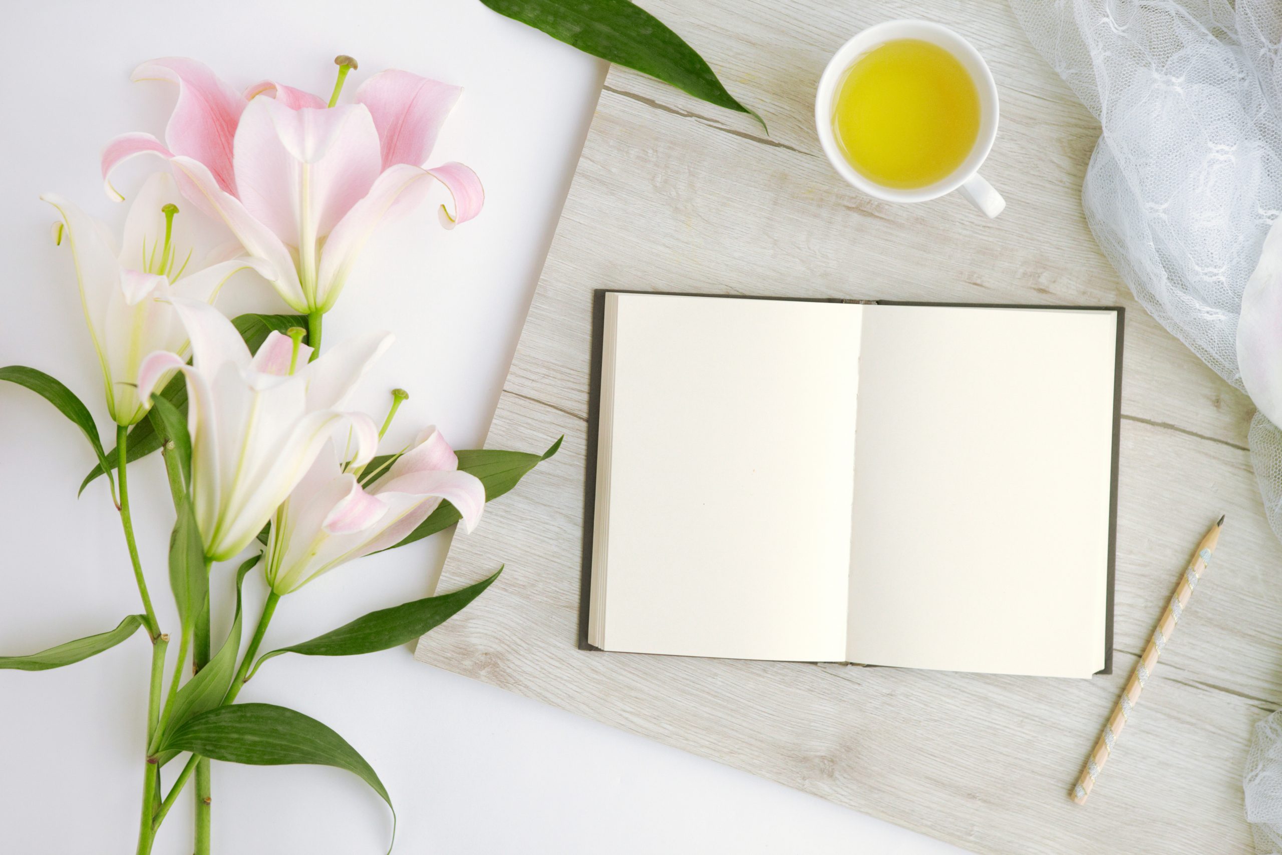 Flaylay with lillies, tea and an open book