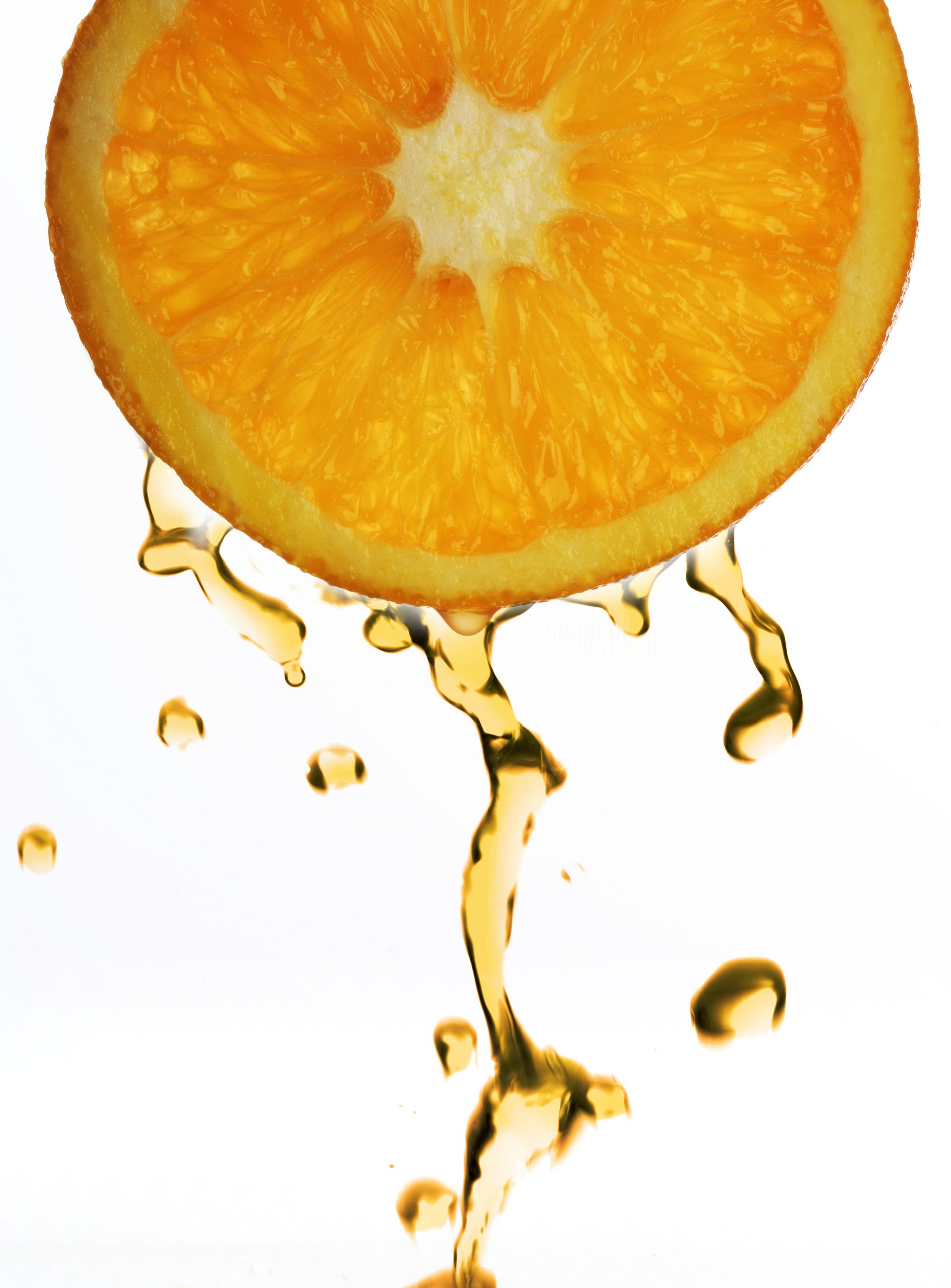Orange juice droping from orange slice
