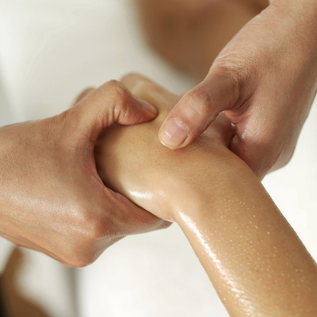 hand being massaged covered in oil