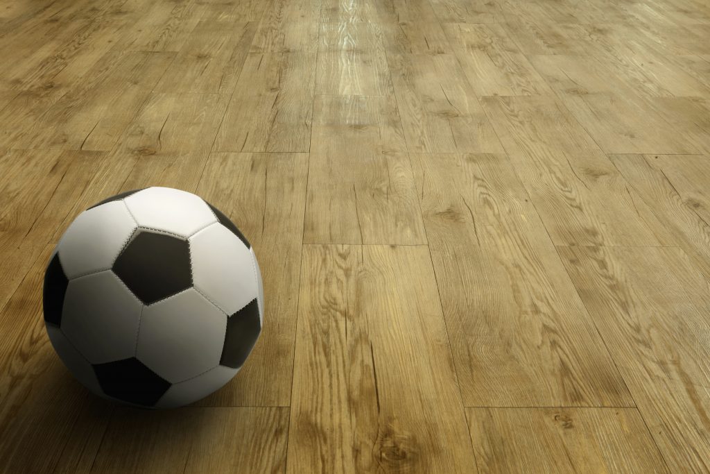 Football on wood laminate flooring