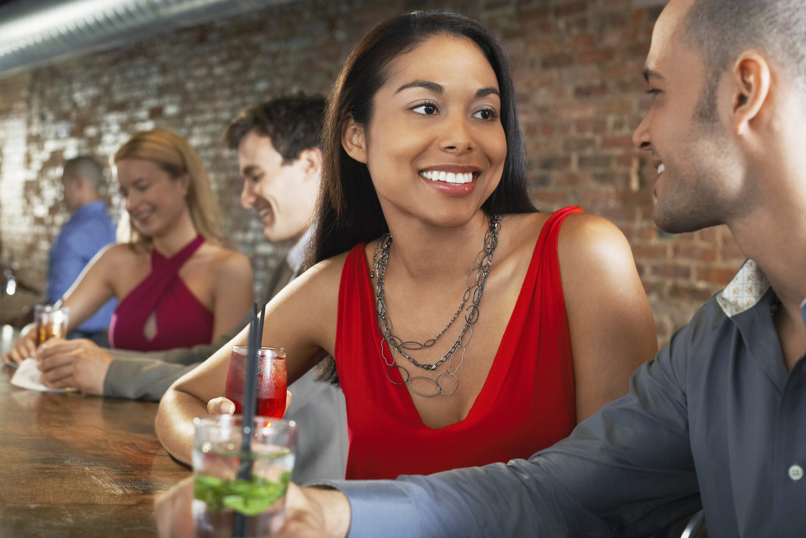 Couple sitting at a bar together Dating In Los Angeles - Top 5 Ideas For LA Dates