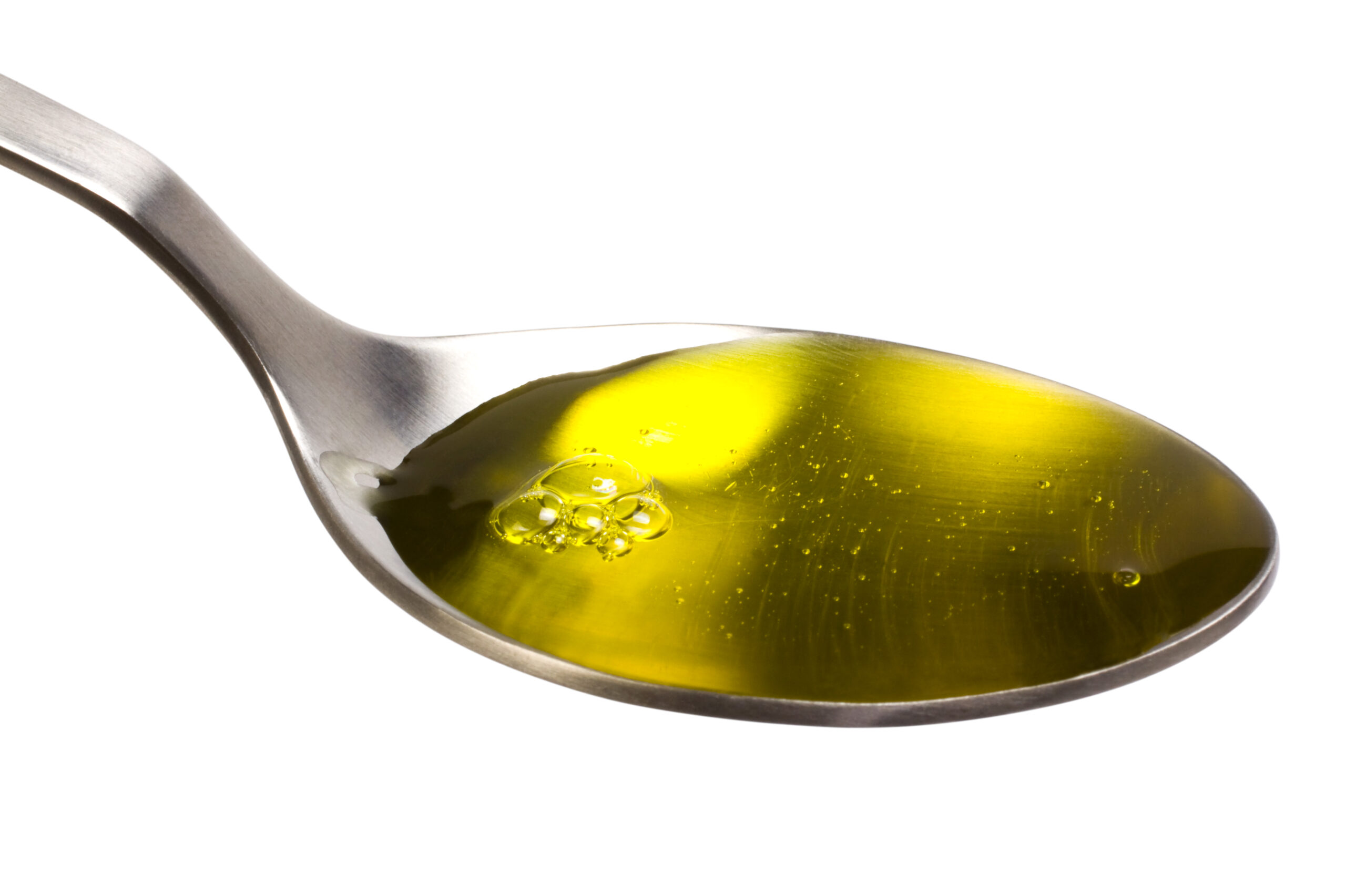 Close-up of a spoonful of CBD oil