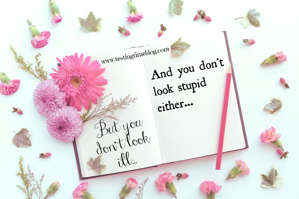 But you don't look ill and you don't look stupid - invisible disabilities on a flatlay with a book and pink flowers
