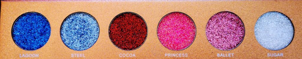 Jolie Beauty Bomb Dot Com Palette showing the first row of shades