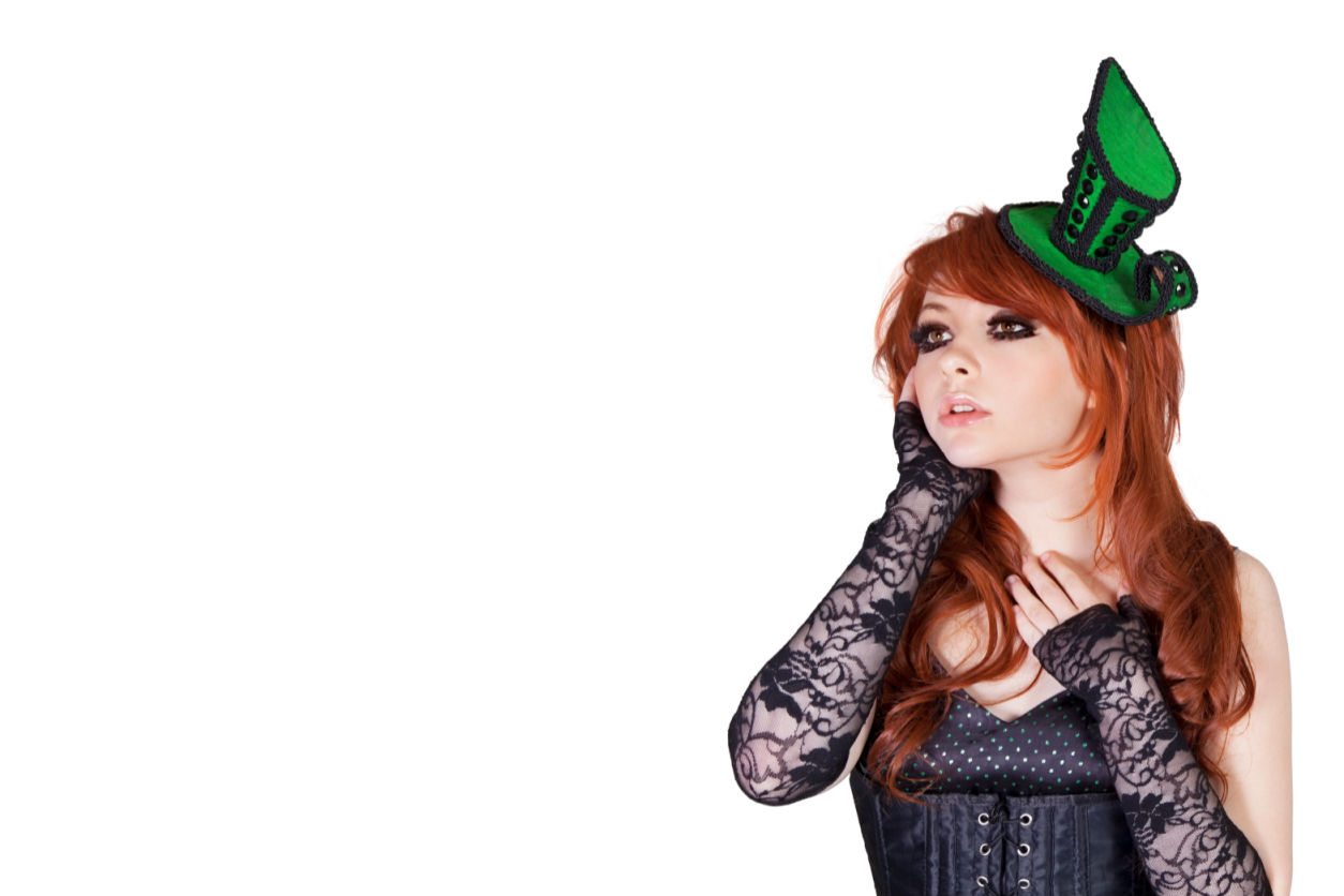 Teenage gothic girl looking away over white background in Modern Corsets