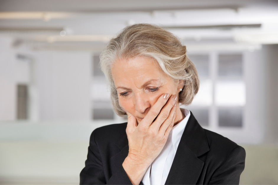 Worried senior businesswoman with hand on mouth in office 8 Ways To Try And Prevent Anxiety